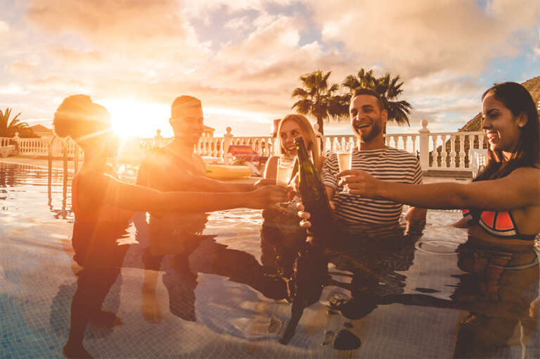 Friends celebrating at sunset